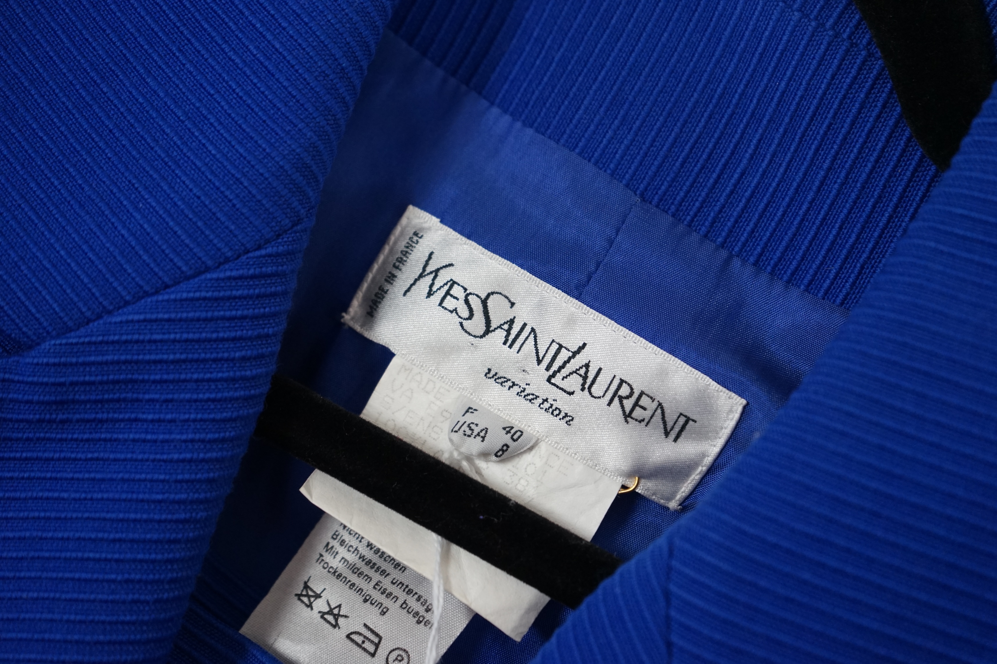 Two vintage Yves Saint Laurent variation lady's wool skirt suits, royal blue and pink. F 40 (UK 12). Please note alterations to make the waist smaller may have been carried out on some of the skirts. Proceeds to Happy Pa